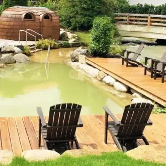 Bachmair-Weissach-Slider Bachmair Weissach Hotel, Schwimmteich, Bild@S.Mueller-Hofner, Trips4kids.de