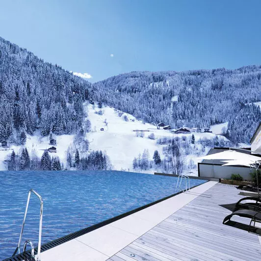 infinity-outdoorpool_mit_bergpanorama_im_winter_das_seemount Foto: © Das SeeMount Resort